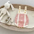 Pink and white knitted baby romper set with bow embroidery and soft matching booties - Size 90 / Pink Romper