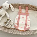 Pink and cream knitted baby romper with bow patterns and matching soft sole shoes - Size 100 / Apricot Romper