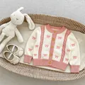 Pink and beige baby girl knitted cardigan with bow patterns and wooden buttons - Size 66 / Apricot Cardigan