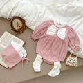 Pink infant bodysuit with large white bow, matching hat, and socks set for baby girls - Pink / 66cm