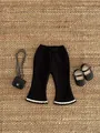 Detail view of girls flared fleece pants with white wavy hem and vertical ribbing texture - 66 / Black