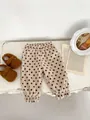 Infant cream corduroy trousers with brown polka dots and elastic ruffled cuffs - 120cm / Apricot