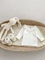Detail of white cotton baby top with lace ruffle collar and matching bow shoes - 66cm / Double-Layer Lace