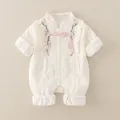 Newborn cream-colored Chinese style romper with floral embroidery and button detail - Beige / 73