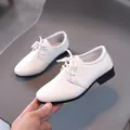 Classic white leather dress shoes for boys with lace-up design and textured finish - Size 26-30 / White
