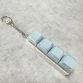 Light blue 4-key mechanical keyboard fidget toy keychain with a metallic spring chain - 4-Key White Shell Blue