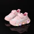 Pink girl's sneakers with floral patterns and LED light-up soles on black background - Size 21 / Pink