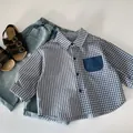 Detail of boys' spliced shirt with stripes and checks, blue jeans and leather sandals - 90cm / Blue