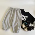Kids black T-shirt and grey joggers set with cartoon embroidery in minimalist style - 100cm / Heather Grey