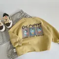 Flat lay of yellow kids sweatshirt with cartoon dog print and striped cotton trousers - Yellow / 90cm