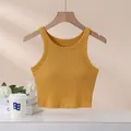 Ärmelloses senfgelbes geripptes Crop Top mit integrierten Brustpolstern für Yoga Fitness - S / Ingwergelb