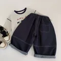 Completo jeans bambino con t-shirt cartoon e pantaloni larghi in stile coreano - 90 / Blu scuro