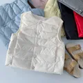 Flach liegende gesteppte Daunenwesten für Kinder in verschiedenen Farben - 90cm / Gebrochenes Weiß