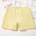 Light yellow girls' cotton safety shorts with elastic waist and bow detail - M / Light Yellow
