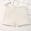 Creamy white girls' cotton safety shorts with elastic waist and delicate ribbon bow - M / Off-white