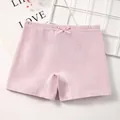Pink cotton safety shorts for girls featuring a cute ribbon bow and elastic waistband - M / Light Purple