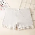 Girls' grey cotton safety shorts with white lace trim and bow accent on the waist - M / Gray