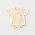 Detail of bamboo fiber baby bodysuit featuring breathable texture and lamb embroidery - 52 / Yellow Sheep