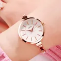 Elegant rose gold women's quartz bracelet watch with white dial on wrist - IP Rose Gold Case White Dial