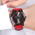 GEDI men's quartz watch with black dial, red markers and matching leather strap on wrist - Red