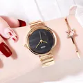 Reloj minimalista para mujer en aleación dorada con esfera negra y pulsera estrella - Color Oro Negro