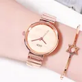Minimalist rose gold women's quartz watch with textured dial and bamboo-style metal bracelet - Rose Gold Case Rose Gold Dial