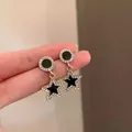 Gold star drop earrings with black enamel accents and sparkling tassel details - E725 Gold / 925 Silver Needle