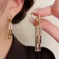 Elegant gold-plated tassel drop earrings with black enamel accents and zircon stones - E2268 Black / 925 Silver Needle