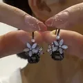 Elegant floral drop earrings featuring white petals and dark grey faceted crystals - E2288 Black / 925 Silver Needle