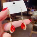 Elegant gold drop earrings featuring red teardrop gemstone with micro pearl halo accents - E1443 Red / 925 Silver Needle