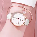 Elegant white leather GEDI watch and matching rose gold heart bracelet on wrist - Rose Gold Case White Dial