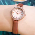 Women's rose gold quartz watch with diamond bezel and brown leather strap on wrist - Rose Gold Case Yellow Dial Brown Strap