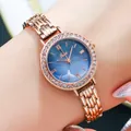 Elegant rose gold watch with blue mother-of-pearl dial and sparkling crystal bezel - Rose Shell Black Belan Face Rose Ribbon