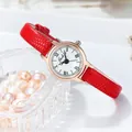Vintage women's quartz watch with red leather strap and elegant gold round small dial - Red