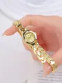 Elegant gold quartz bracelet watch for women featuring rhinestone markers and chain strap - Gold Case Gold Dial