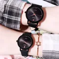 GEDI quartz couple watches with black leather straps and rose gold markers on wrists - Men's Style (Black Out)