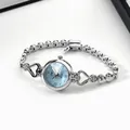 Detail of silver heart-shaped watch lugs with rhinestones and light blue radial dial - Silver Case Blue Dial