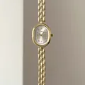 Detailed macro view of vintage golden oval watch dial with Roman numerals and metal chain - Gold Case White Dial