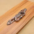 Antique bronze zinc alloy cabinet handle with ornate baroque skull and floral pattern - 64mm / Red Bronze