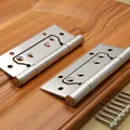 Macro shot of 4-inch stainless steel door hinges with screws on a wooden surface - 4 Inch 3.0mm Thickness (Style B)