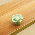 Detailed view of light green ceramic lotus cabinet knob with intricate layered petals - Green