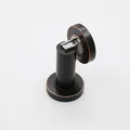 Macro detail of magnetic door stopper in matte black and bronze finish for wall mounting - Matte Black Red Edge