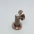 Detail of magnetic door stopper in brushed red copper finish with cylindrical base - Red Bronze