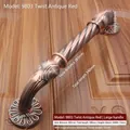 Detail view of antique bronze door handle with 285mm hole spacing and spiral design - Total Length 340mm / Twist Pattern - 9803 / Red Bronze