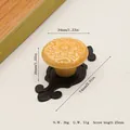 Detail of yellow ceramic cabinet knob with floral relief and black zinc alloy base - Matte Black Yellow