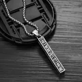 Vintage Sanskrit mantra pendant necklace in polished silver on dark wood table - Lotus World Style (Swastika) / Steel Color with Stainless Steel Chain