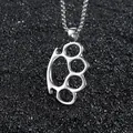 Polished stainless steel brass knuckles pendant necklace on a dark textured background - Silver