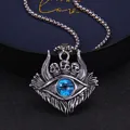 Macro shot of gothic evil eye pendant with three skulls and blue eye on metal chain - Standard Type / Blue