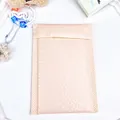 Pastel pink bubble mailer envelope with waterproof texture and secure seal closure - 11cm x 14cm / Pink