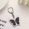 Llavero de mariposa acrílica estilo Y2K en negro y violeta con cierre plateado - Mariposa Moteada Negra Y Púrpura (6)
